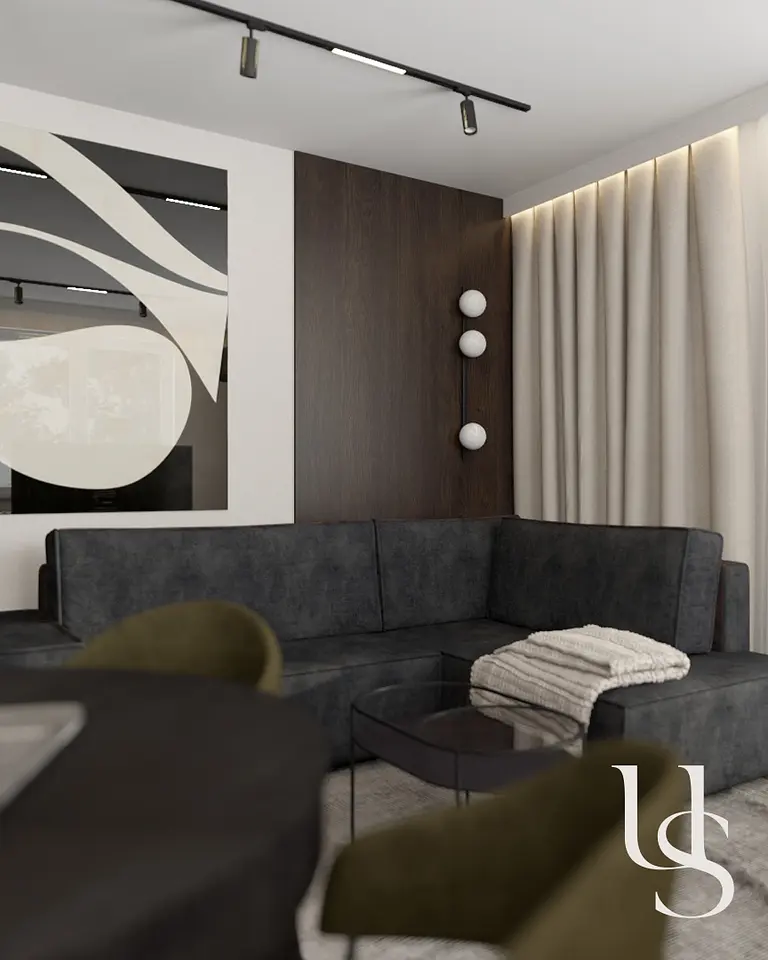 Wnętrze salonu w stylu quiet luxury, współczesnym z ciemną sofą i drewnianymi akcentami.