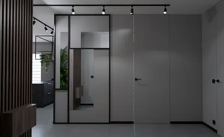Przedpokój w stylu industrialnym i minimalistycznym z szarymi ścianami i nowoczesnymi detalami.