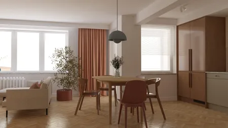 Wnętrze jadalni z drewnianym stołem, roślinami i eklektycznymi akcentami.