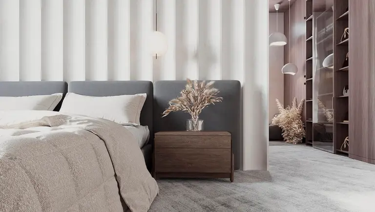 Wnętrze sypialni z szarym łóżkiem, minimalistycznym designem i nowoczesnymi akcentami.