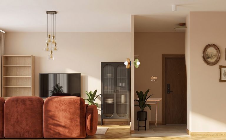 Wnętrze salonu w stylu art deco i boho z brązową sofą.