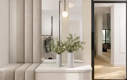 Wnętrze garderoby z minimalistycznym designem, lustrami i roślinami.