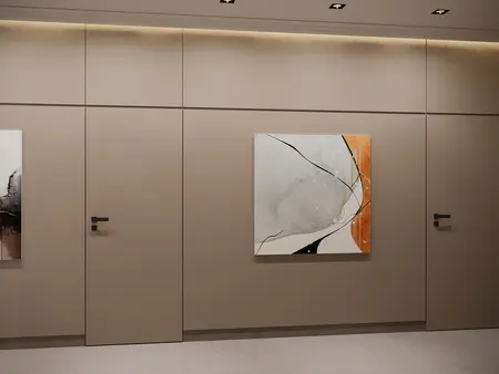 Minimalistyczne wnętrze z beżowymi ścianami i nowoczesnym obrazem.
