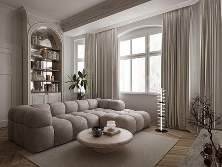 Eklektyczny salon z beżową sofą, drewnianym stolikiem i rośliną.