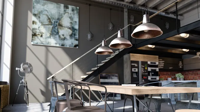 Wnętrze jadalni z drewnianym stołem, metalowymi lampami, industrialnymi detalami.