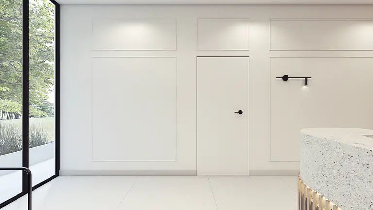 Minimalistyczne wnętrze z białymi ścianami i nowoczesnym oświetleniem.