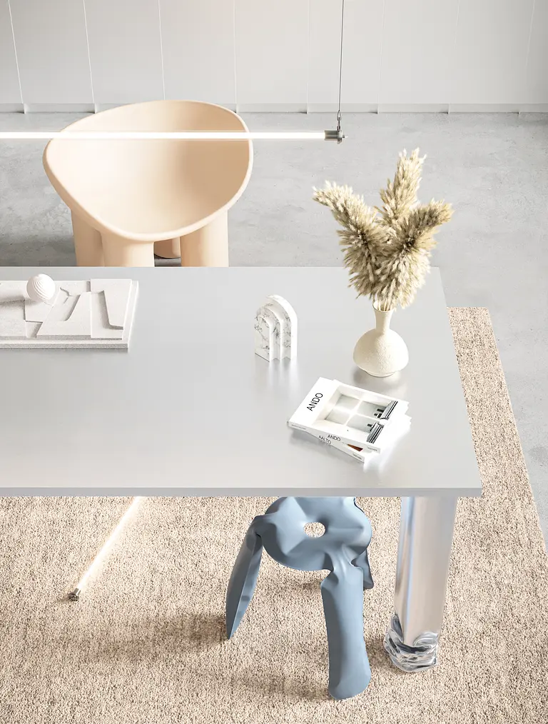Wnętrze biura w stylu industrialnym z minimalistycznym biurkiem i nowoczesnym krzesłem.