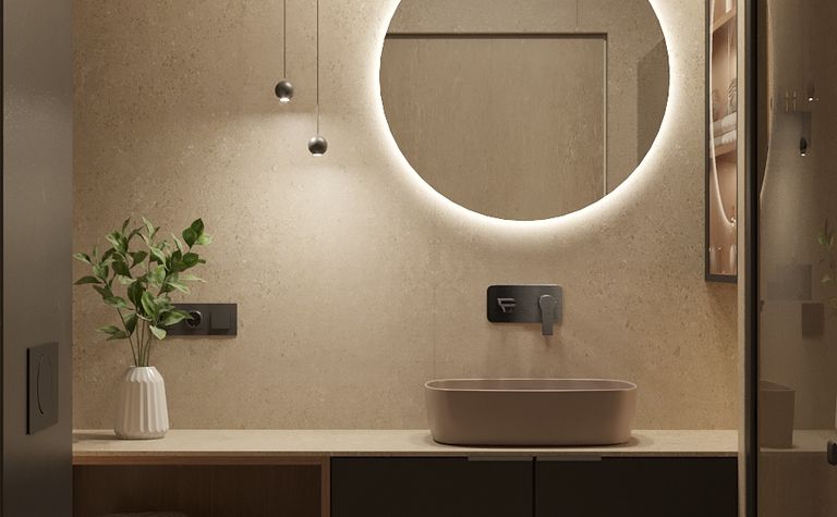 Nowoczesna łazienka z okrągłym lustrem, minimalistycznym designem i naturalnymi materiałami.