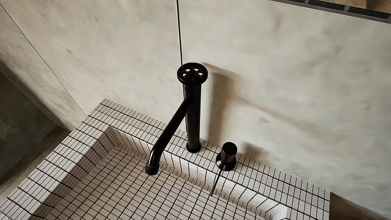 Widok na czarny kran w minimalistycznej łazience z kafelkami.