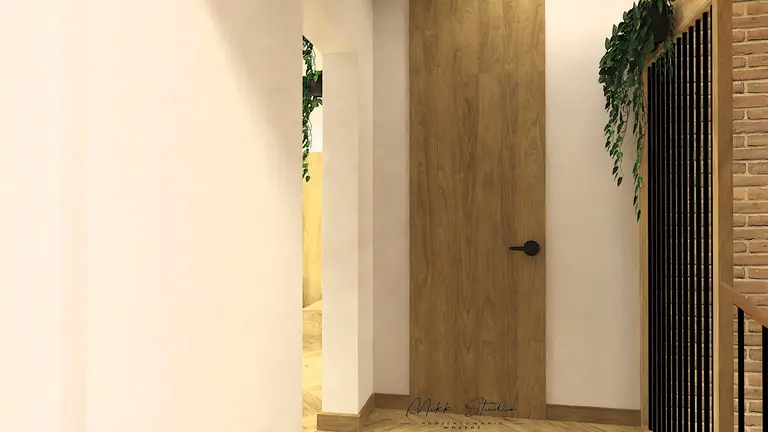 Wnętrze holu z drewnianymi akcentami i roślinnością, styl boho i nowoczesny.