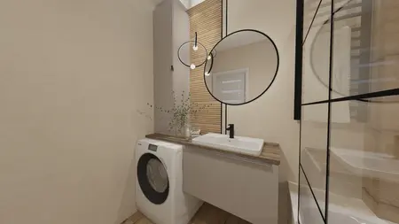 Wnętrze nowoczesnej łazienki z pralką i lustrem