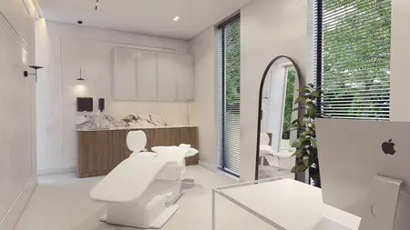 Gabinet w stylu minimalistycznym i nowoczesnym z białymi meblami i drewnianymi detalami.