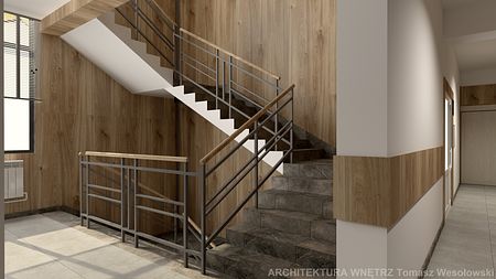 Klatka schodowa z drewnianymi panelami i metalowymi balustradami, współczesny design.