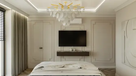 Wnętrze sypialni z białą lampą, beżowymi ścianami i telewizorem.