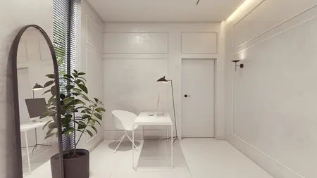 Minimalistyczny pokój z białym biurkiem, rośliną i dużym lustrem.