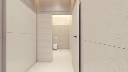 Minimalistyczna łazienka z jasnymi płytkami, nowoczesnym toaletą i prostymi detalami.