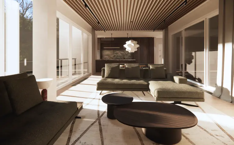 Wnętrze salonu z zielonymi kanapami, drewnianymi detalami i dużymi oknami. Minimaluxe, quiet luxury, soft minimalizm, współczesny.