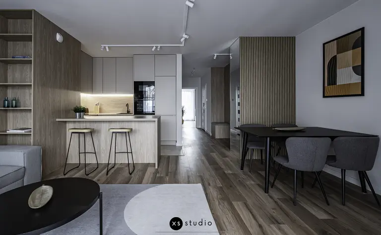 Wnętrze kuchni w stylu japandi z drewnianymi meblami i minimalistycznym oświetleniem.