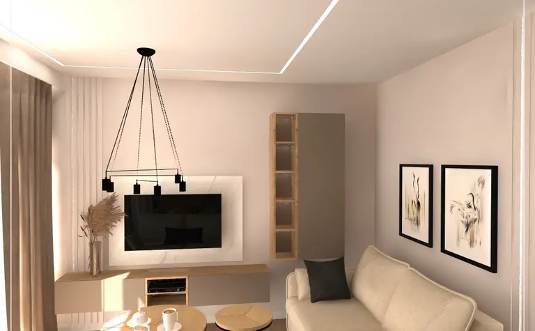 Nowoczesny salon z jasnymi meblami, telewizorem i drewnianymi elementami.