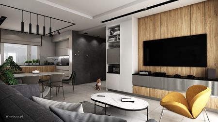 Nowoczesny salon z drewnianymi akcentami, szarością i roślinami.