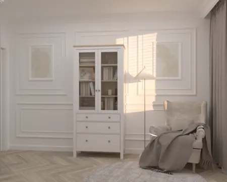 Wnętrze salonu z białą witryną, szarym fotelem i nowoczesnym stylem quiet luxury.