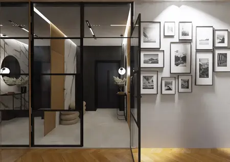 Przedpokój w stylu japandi, minimalistycznym i nowoczesnym z czarnymi detalami.