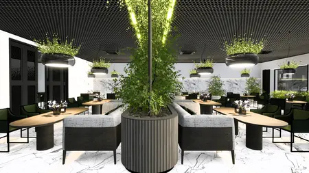 Wnętrze restauracji z zielonymi roślinami i marmurowymi elementami, nowoczesny design.