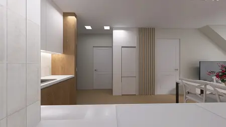 Wnętrze kuchni z minimalistycznym stylem, nowoczesnymi meblami i współczesnymi elementami.