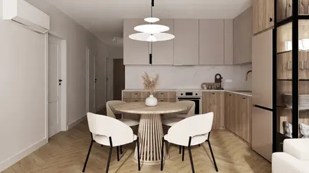 Wnętrze kuchni w stylu minimalistycznym z beżowymi meblami i drewnianym stołem