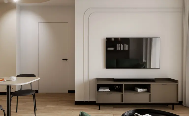 Salon w stylu minimalistycznym i współczesnym z zieloną kanapą i telewizorem