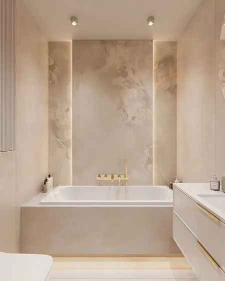 Nowoczesna łazienka minimalistyczna z wanną i złotymi detalami w stylu quiet luxury.
