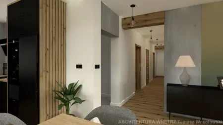 Wnętrze kuchni z czarnymi meblami i drewnianymi akcentami, styl industrialny.
