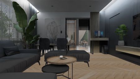 Nowoczesny salon z ciemnymi meblami, drewnianą podłogą i roślinami.