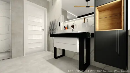 Nowoczesna łazienka minimalistyczna z białą umywalką i czarnymi detalami.