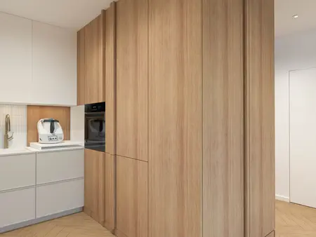 Kuchnia japandi z drewnianymi szafkami i minimalistycznym designem.