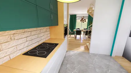 Wnętrze kuchni z zielonymi szafkami, drewnianym blatem i nowoczesnymi akcentami.