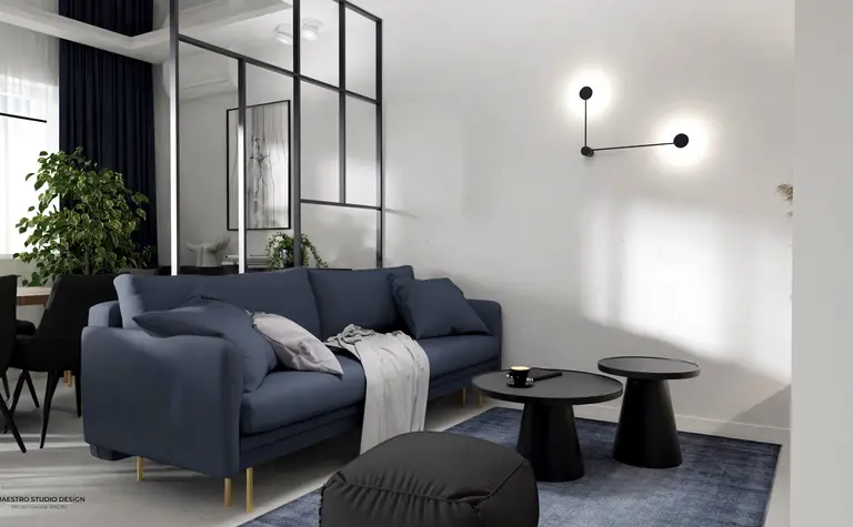 Nowoczesny salon z niebieską sofą, minimalistycznymi meblami i roślinami w stylu industrialnym.