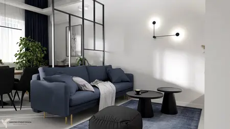 Nowoczesny salon z niebieską sofą, minimalistycznymi meblami i roślinami w stylu industrialnym.