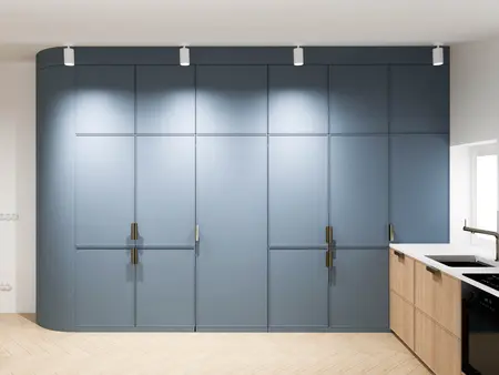Kuchnia minimalistyczna z niebieskimi szafkami i białym blatem.