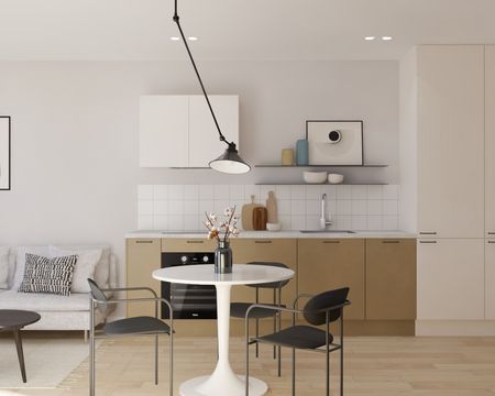 Jasna kuchnia w stylu japandi z minimalistycznym wystrojem.