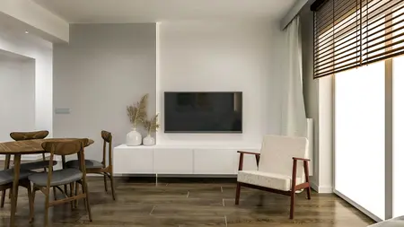 Wnętrze salonu z minimalistycznym wystrojem, drewnianym stołem, telewizorem i roślinami.