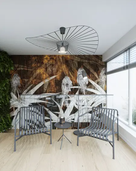 Nowoczesny salon z muralem roślinnym, metalowymi fotelami i drewnianą podłogą.