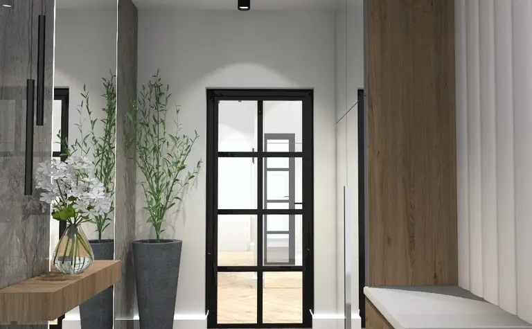 Przedpokój w stylu minimalistycznym z drewnianymi meblami i roślinami.