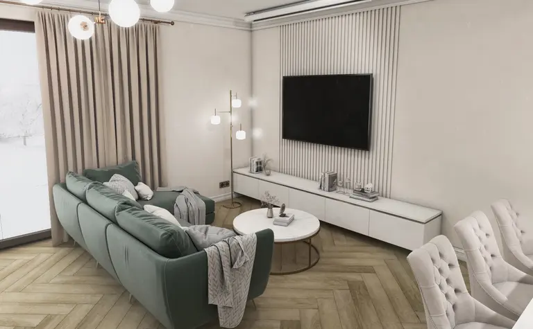 Wnętrze salonu w stylu eklektycznym z zieloną sofą, jasnymi zasłonami i nowoczesnym oświetleniem.