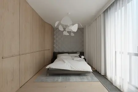 Sypialnia z łóżkiem, szafkami drewnianymi i minimalistycznym oświetleniem.