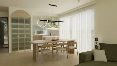 Jasna jadalnia z owalnym stołem drewnianym, czterema krzesłami, designerską lampą sufitową w kształcie pętli oraz szafą o zaokrąglonych drzwiach.