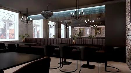 Wnętrze restauracji w stylu industrialnym z ciemnymi meblami i dużymi lustrami.