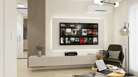 Wnętrze z telewizorem, minimalistyczny styl, nowoczesne meble, spokojna atmosfera.