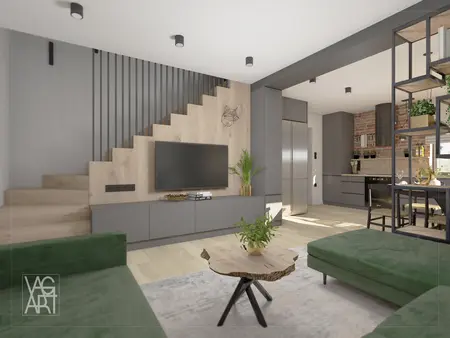 Wnętrze salonu w stylu industrialnym z zielonymi sofami i drewnianym stołem.