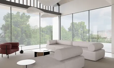 Wnętrze salonu z minimalistycznym designem, nowoczesnymi meblami i dużymi oknami.